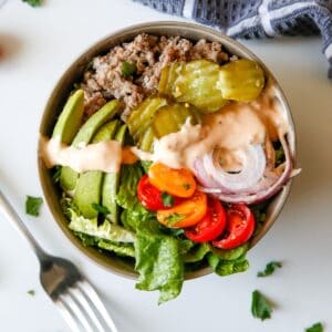 Keto big mac salad in being served in a bowl.