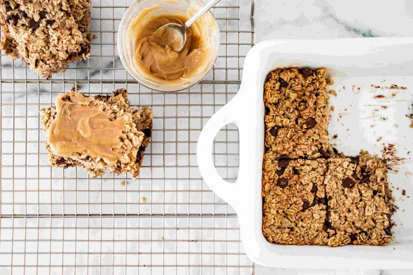 Oatmeal bars in a pan and cooling rack. 