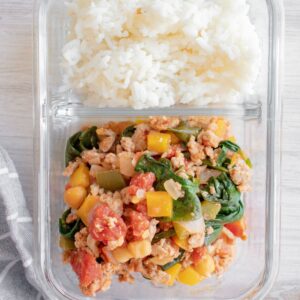 Ground turkey with mixed veggies and rice in a meal prep container.