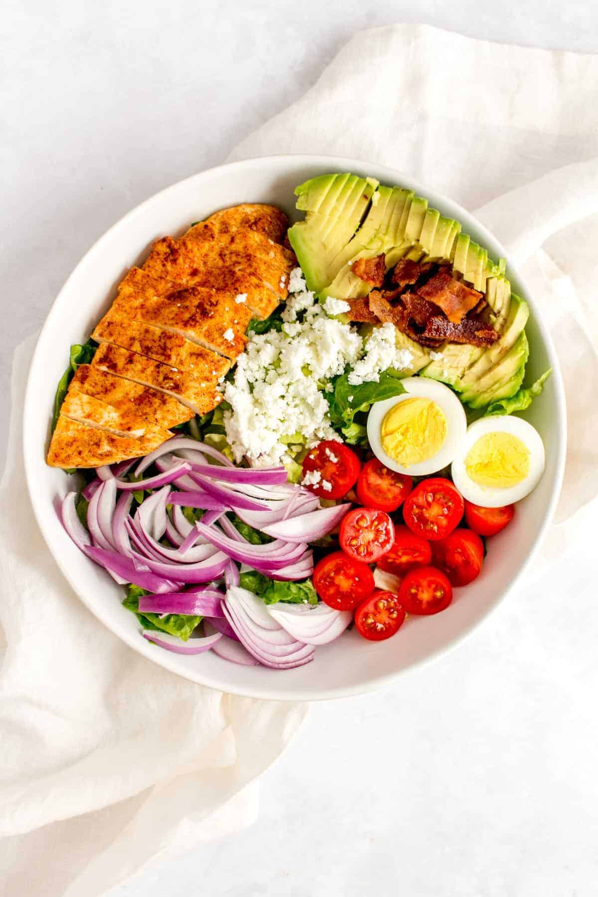 Packed with protein, this super easy healthy Chicken Cobb Salad doesn’t take long to put together and is perfect if you’re looking for a filling salad. It packs really well, making this cobb salad a perfect meal prep as well.