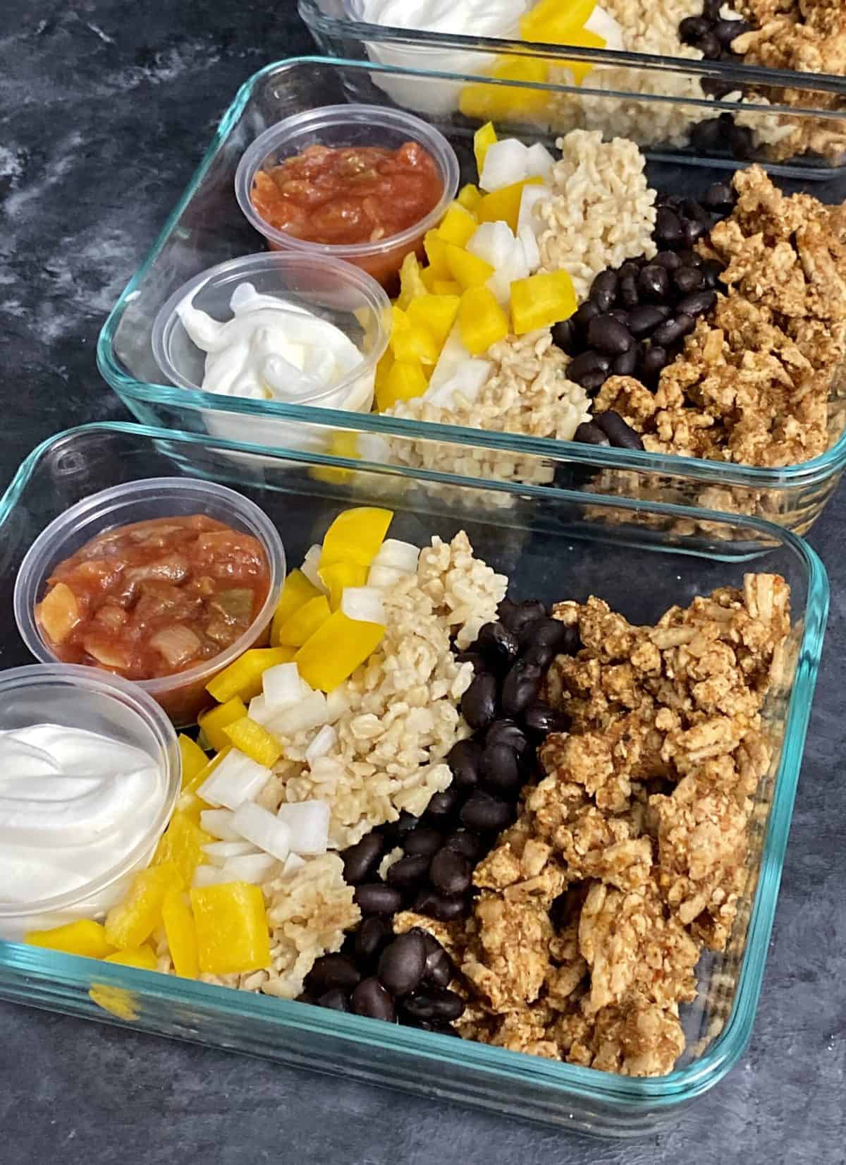 If you want to have a quick high protein lunch or dinner that you can make on Sunday for the week, take a look at this Turkey Taco Bowl.