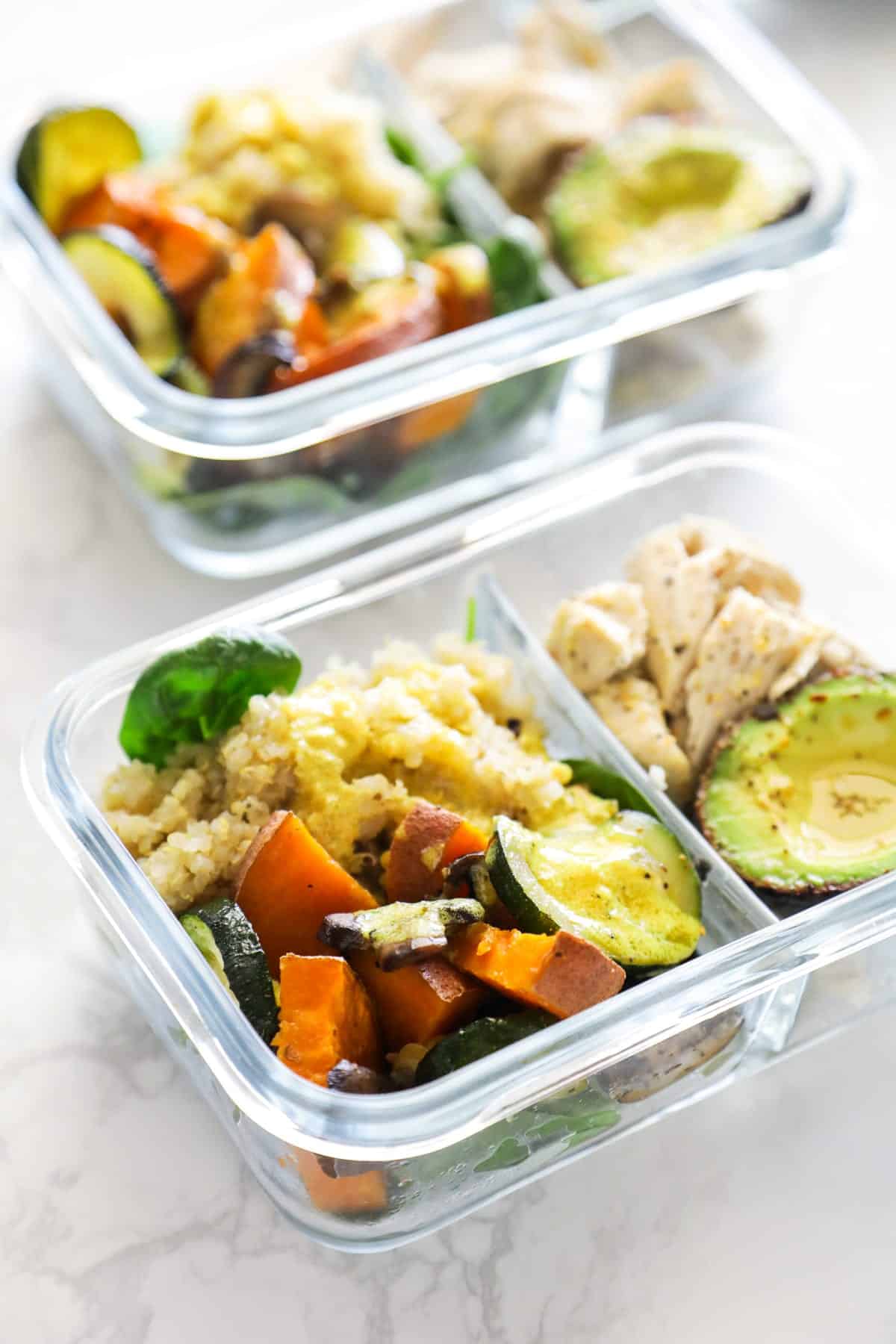 chicken, veggies, and quinoa in meal prep bowls 