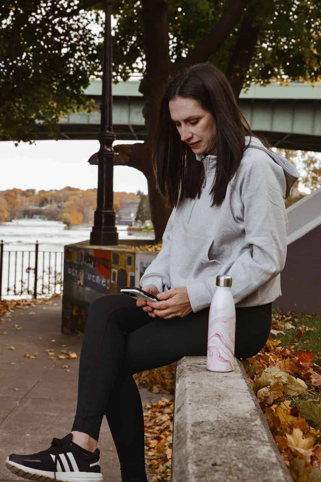 weight loss coach sitting on phone 