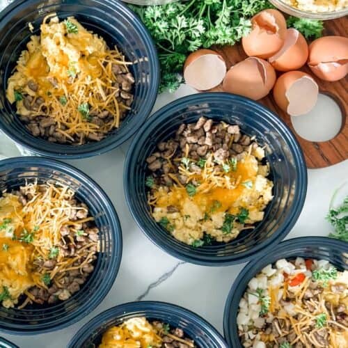 Breakfast bowls with eggs, sausage, and potatoes.