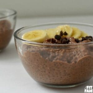 Chocolate chia seeding pudding in a bowl with sliced bananas.
