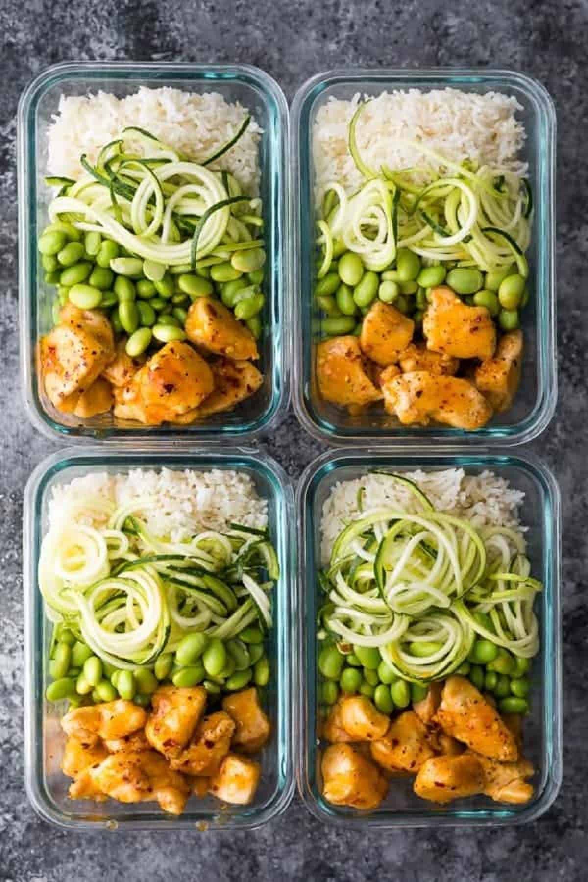 Firecracker chicken meal prep bowls with zoodles and rice. 