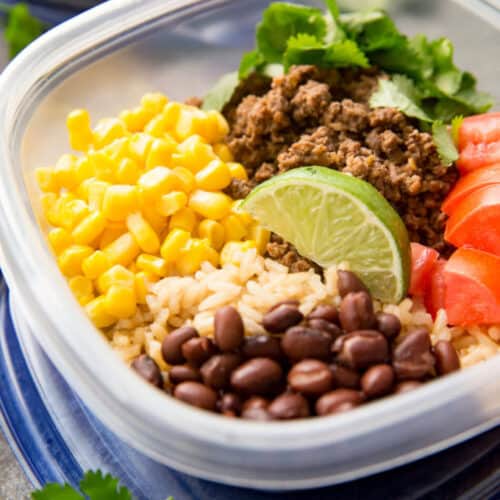 Taco meal prep bowls in plastic containers.