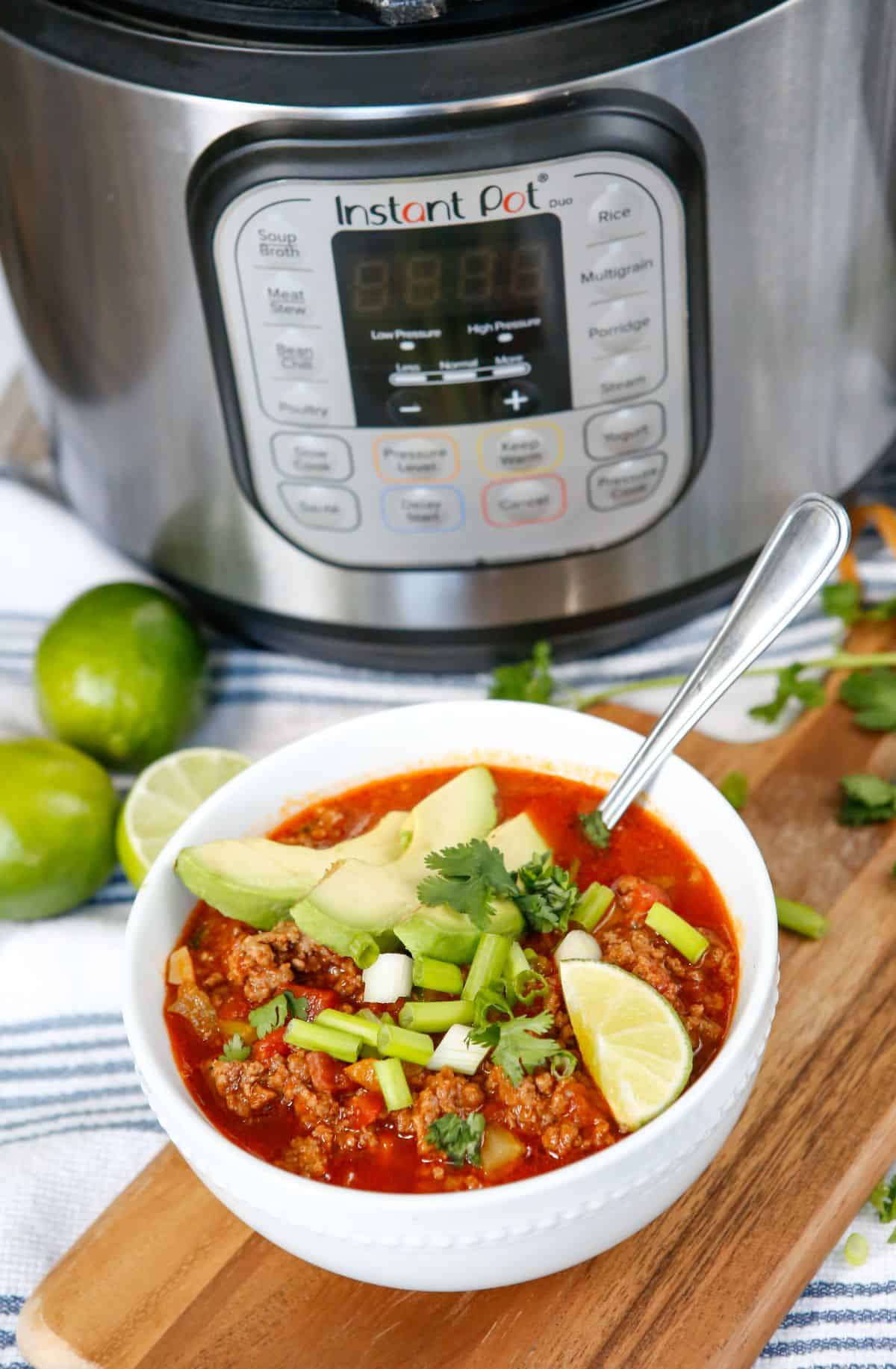 Bowl of no bean chili with an Instant Pot behind it. 