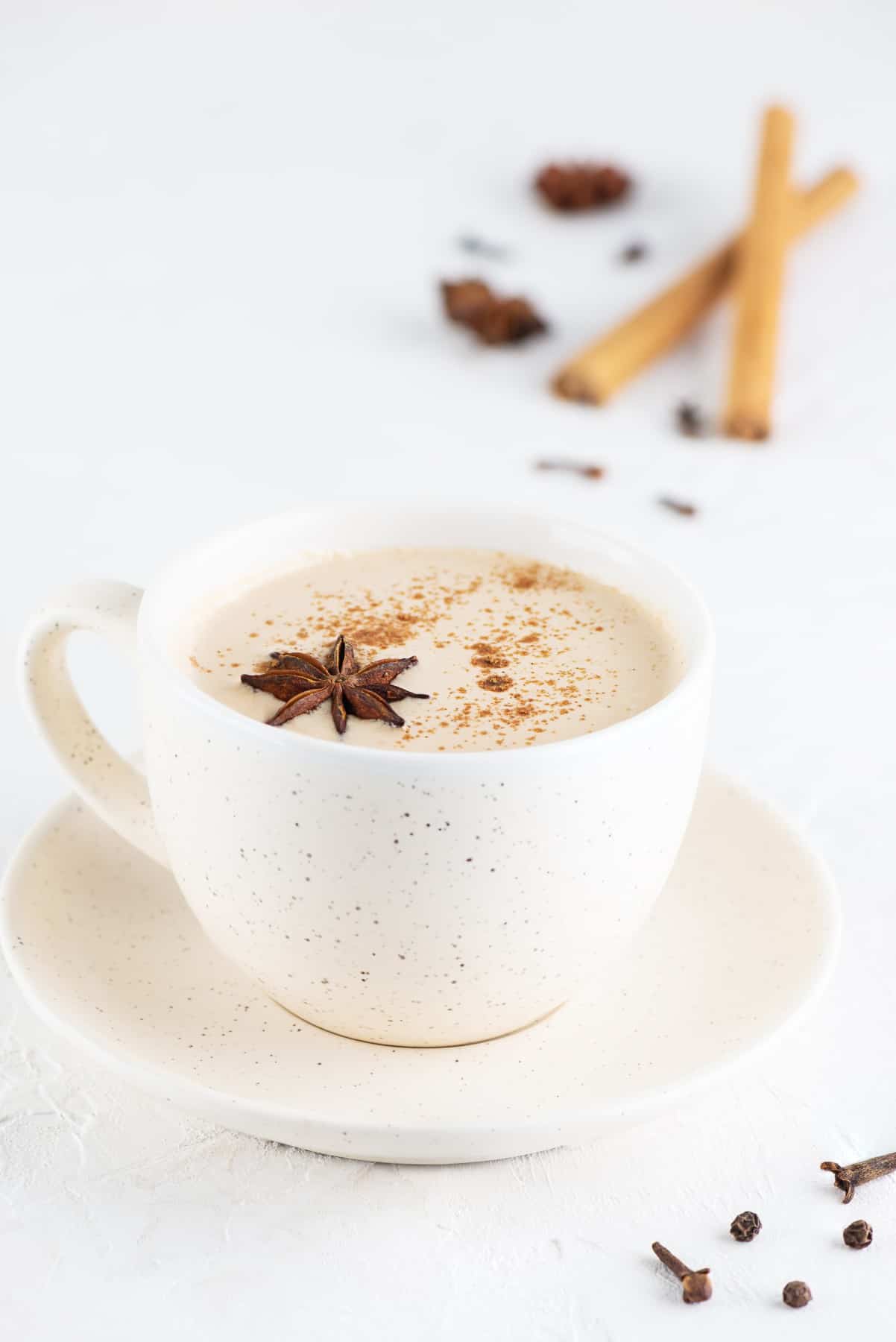 Healthier chai tea latte in a mug with cinnamon and star anise. 