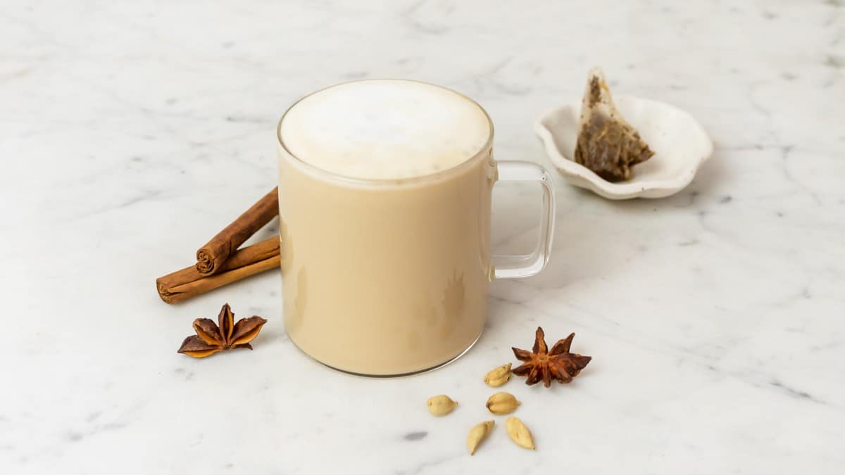 Healthy chai tea latte in a mug with garnishes. 