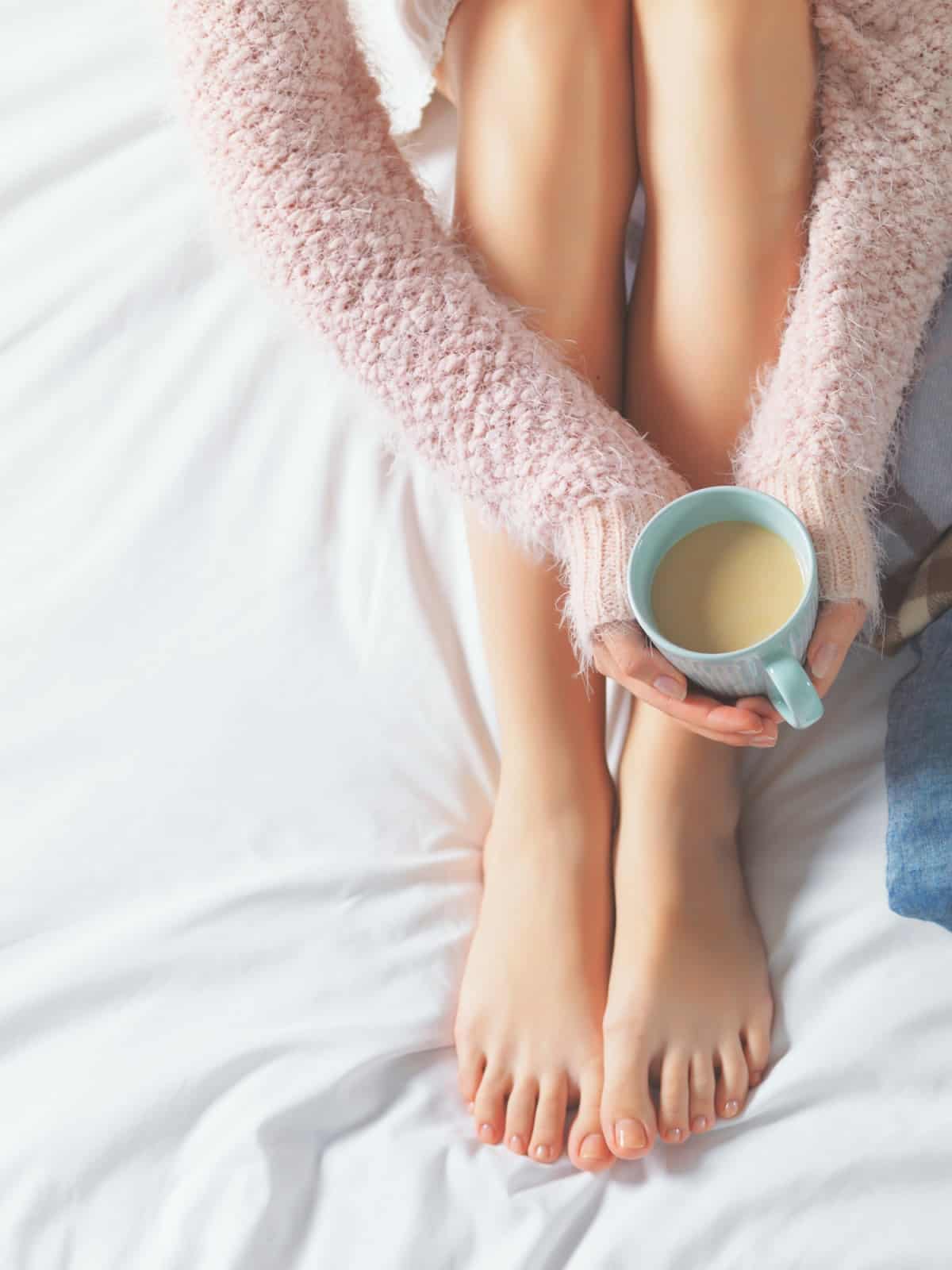 Women holding a cup of coffee. 