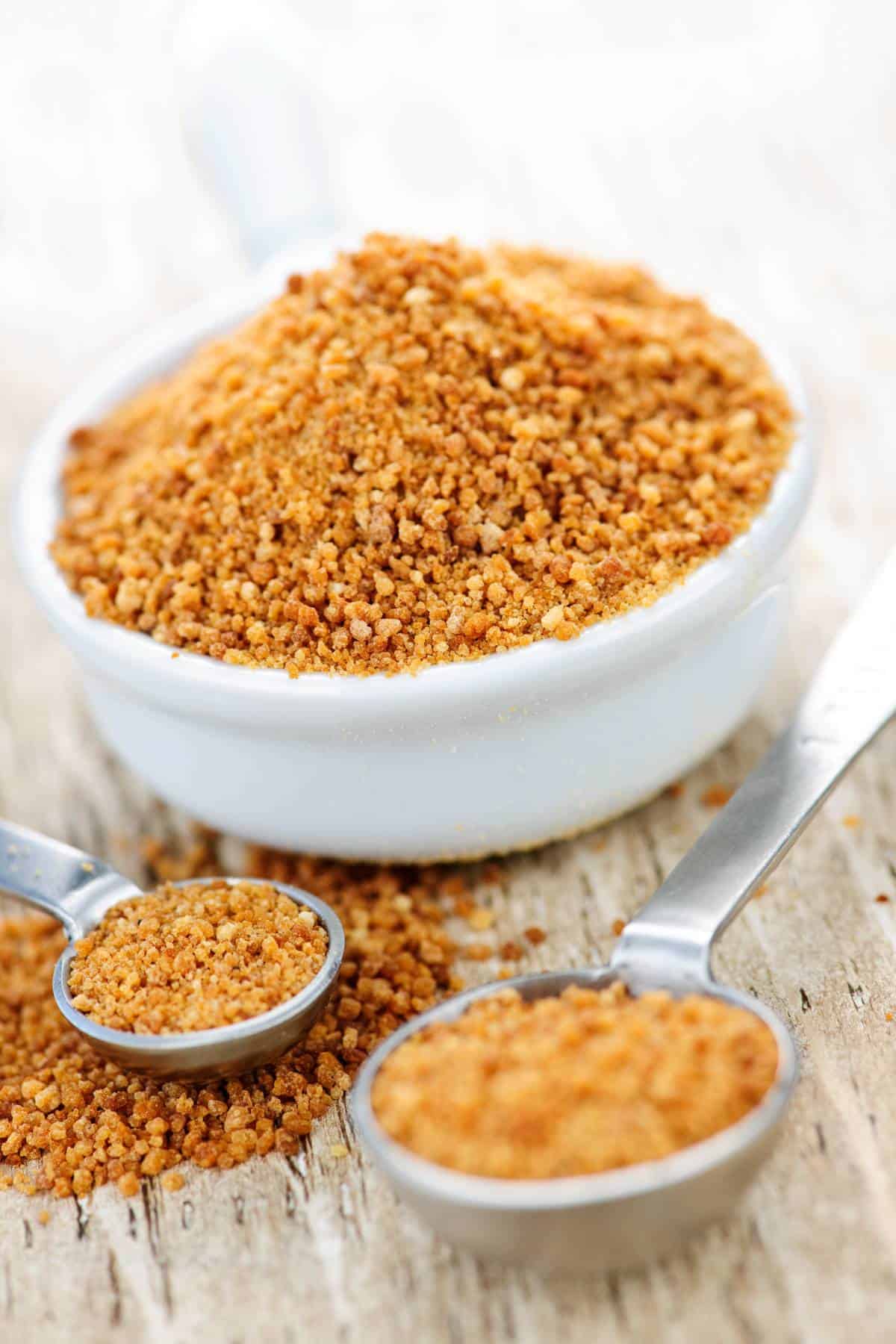 Coconut sugar in a measuring spoon. 