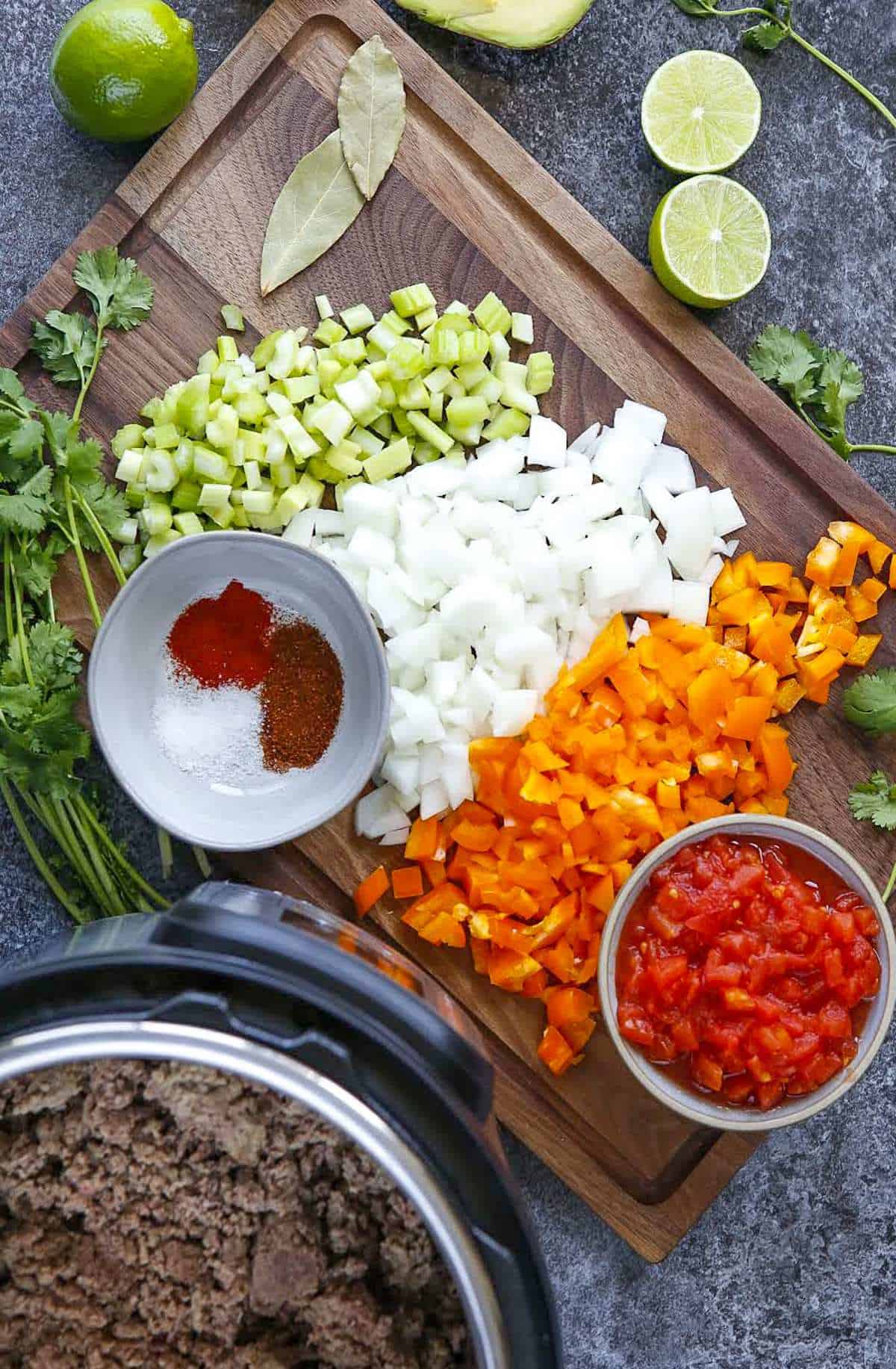 Ingredients for no bean chili on a cutting board. 