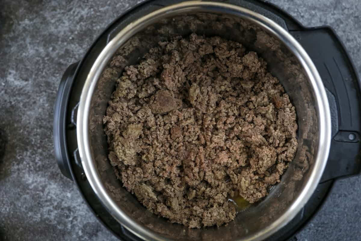 Ground beef being cooked in Instant Pot. 