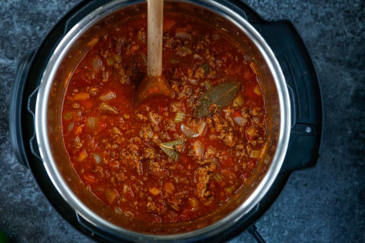 Cooked chili being stirred in Instant Pot. 