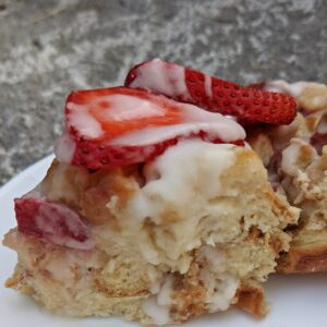 Strawberries and cream protein french toast being served on a plate.