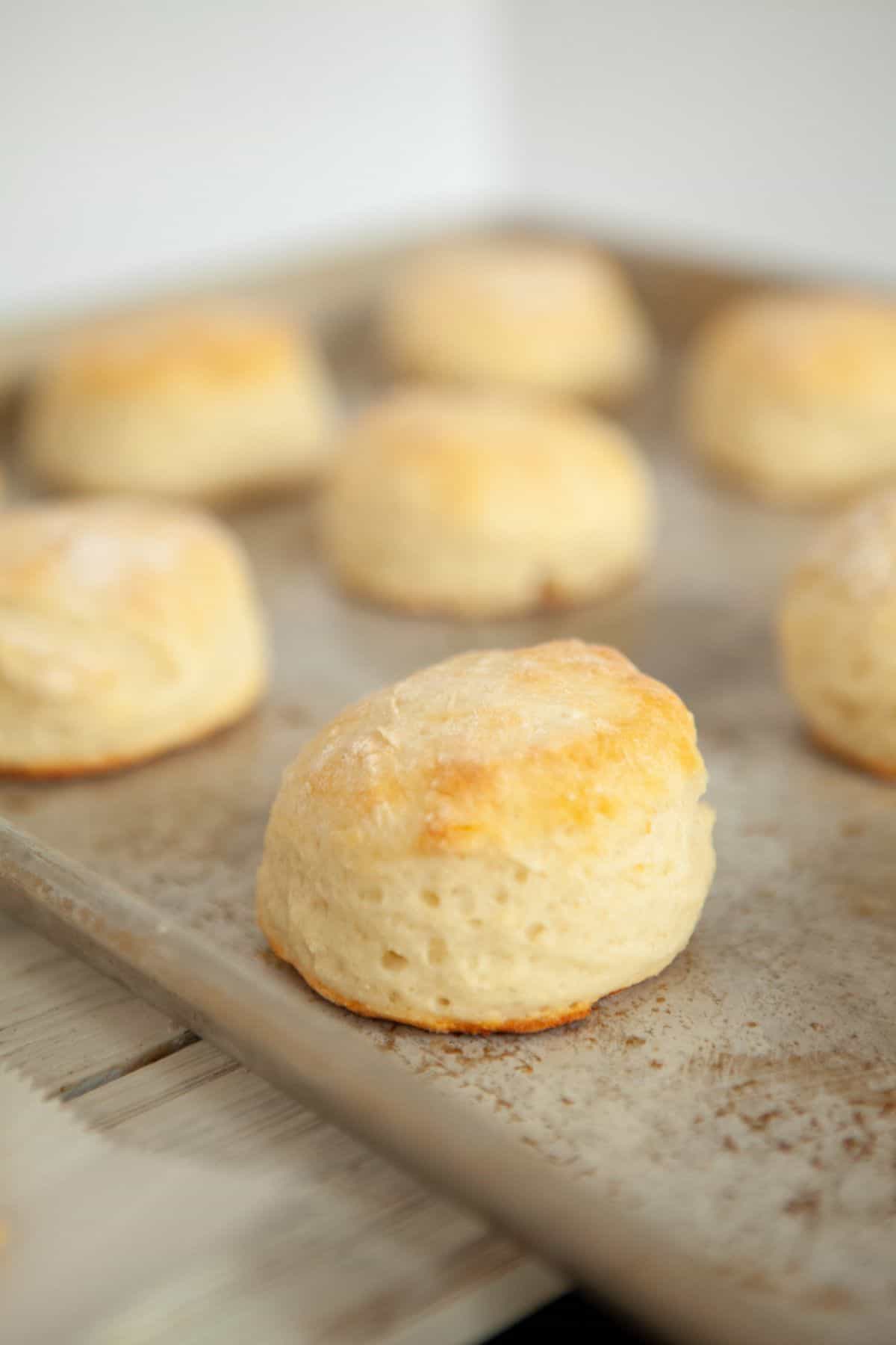 Biscuits being baked on a baking sheet. 