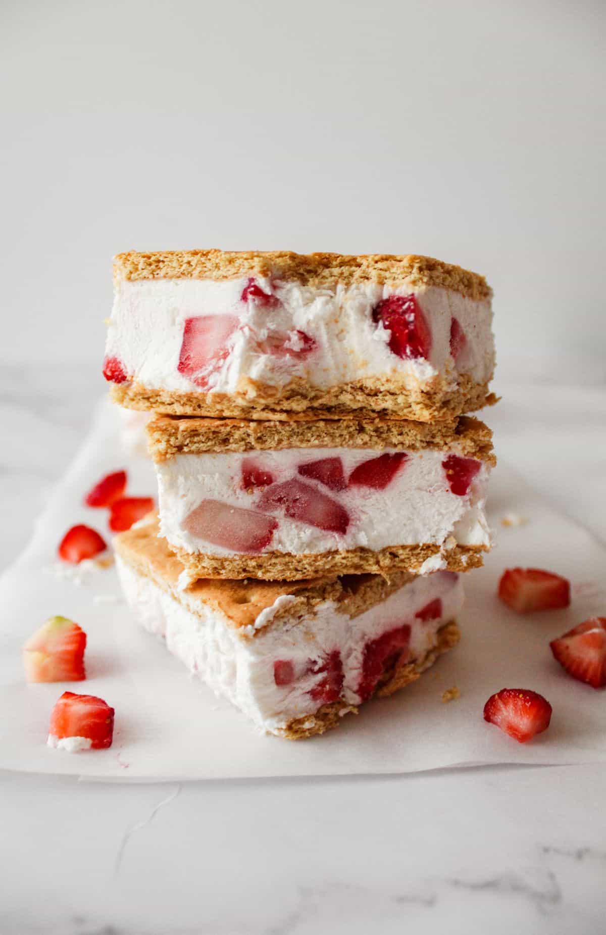 Healthy ice cream sandwiches with strawberries stacked on top of each other. 