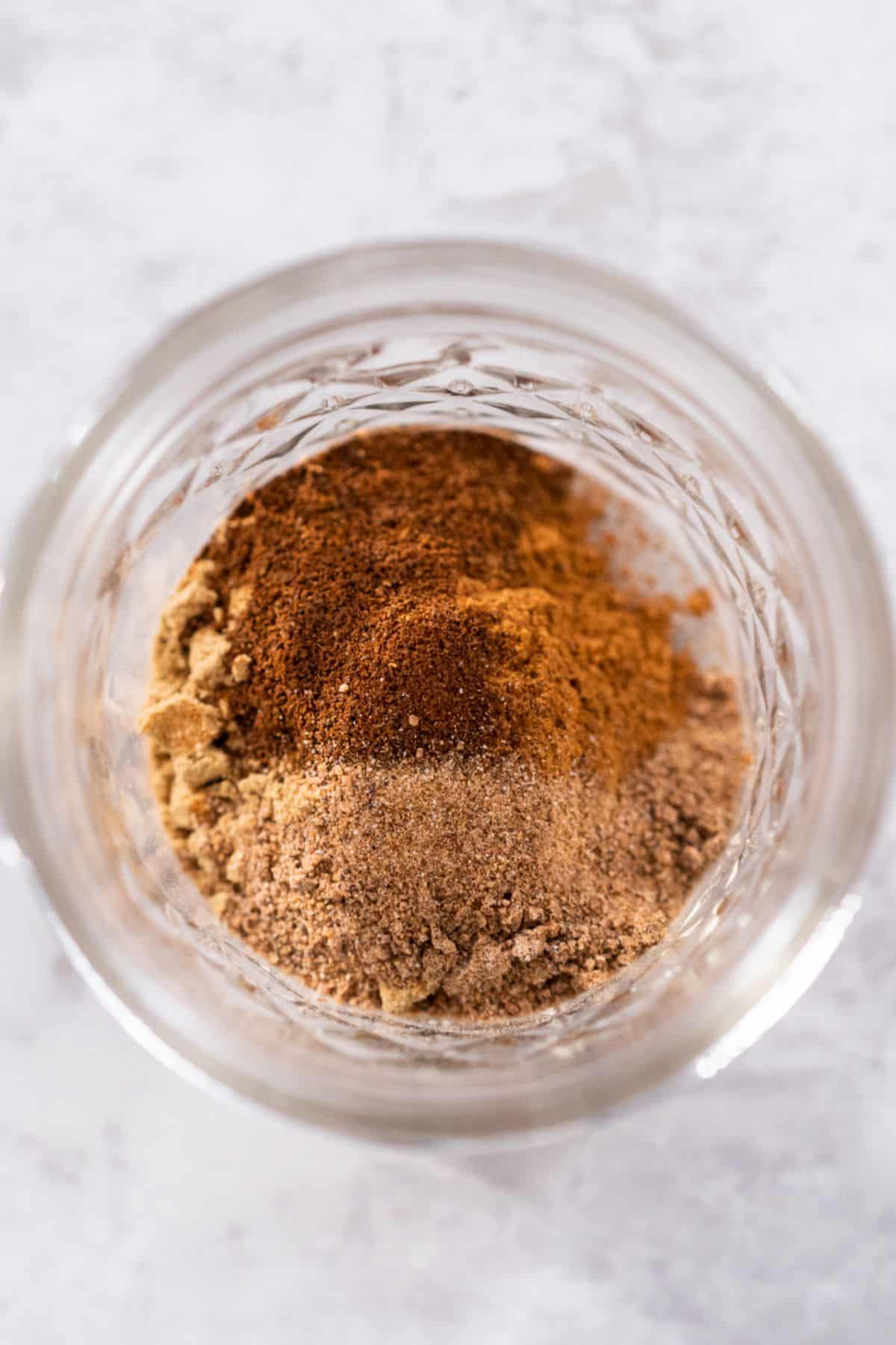 Spices in a jar for pumpkin spice mix. 
