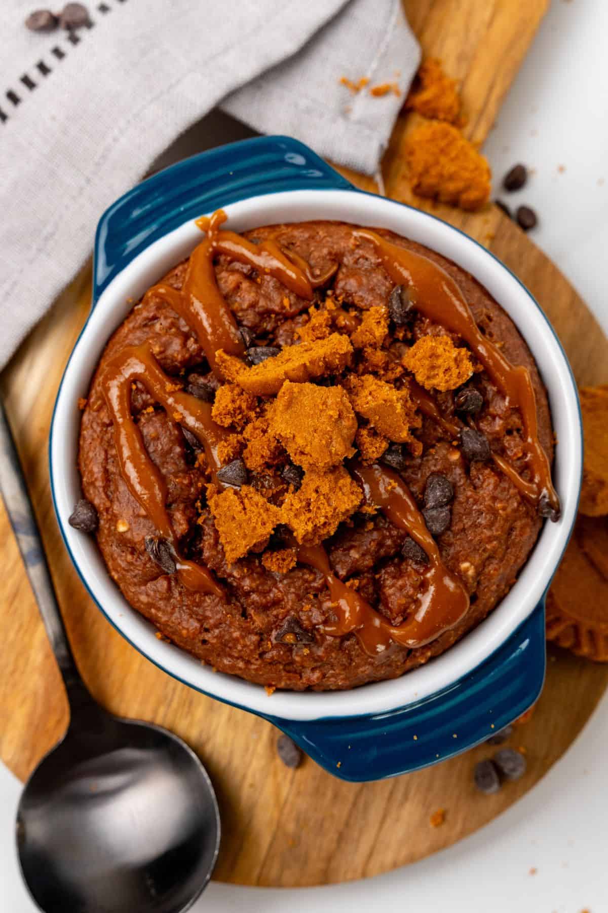 Biscoff baked oats with toppings in a ramekin dish. 