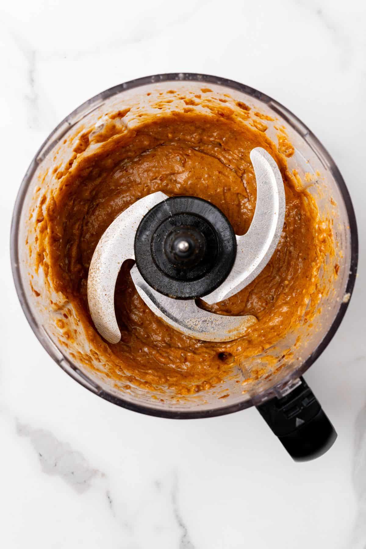 Caramel layer being mixed together in a food processor.