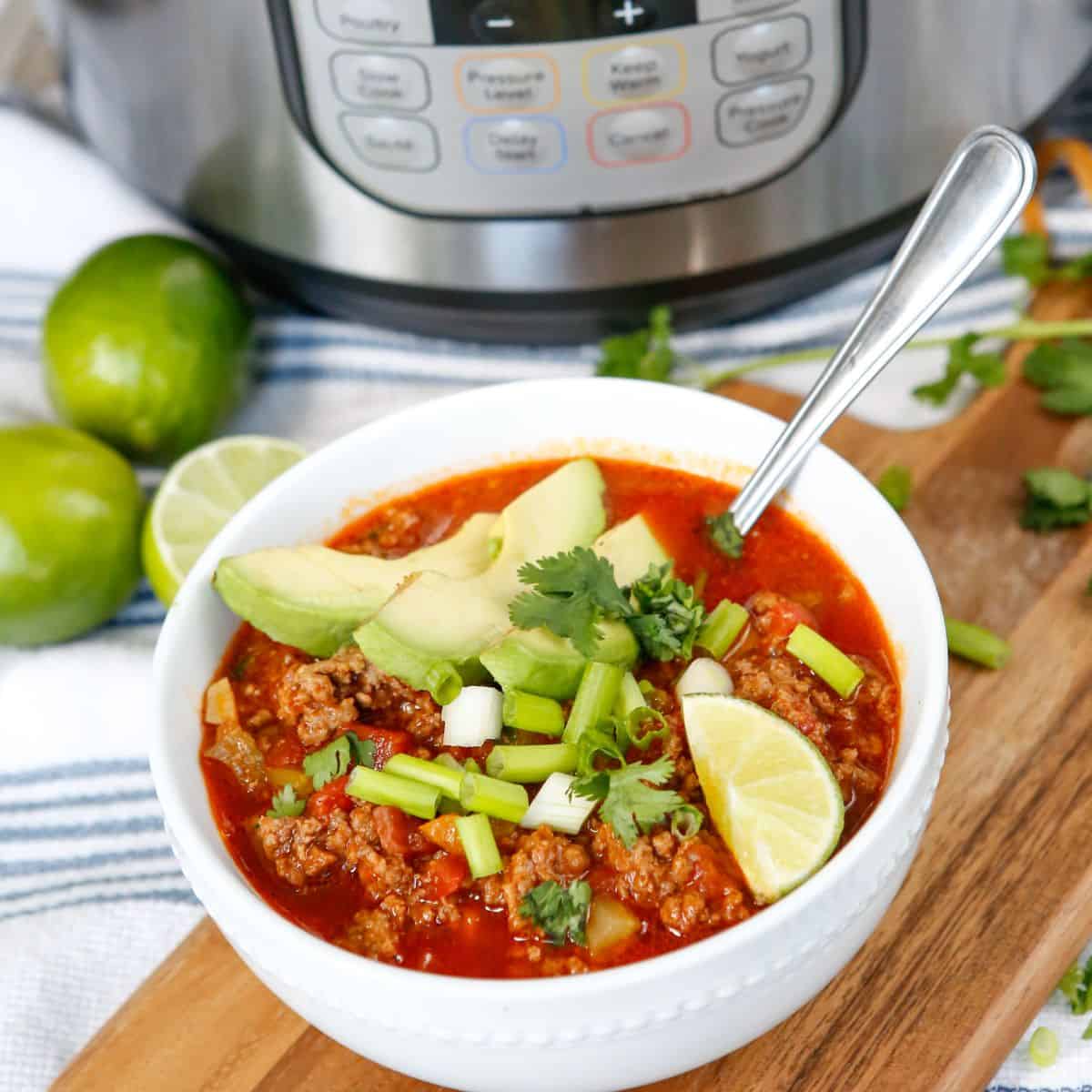 A chili recipe showcased next to an instant pot.
