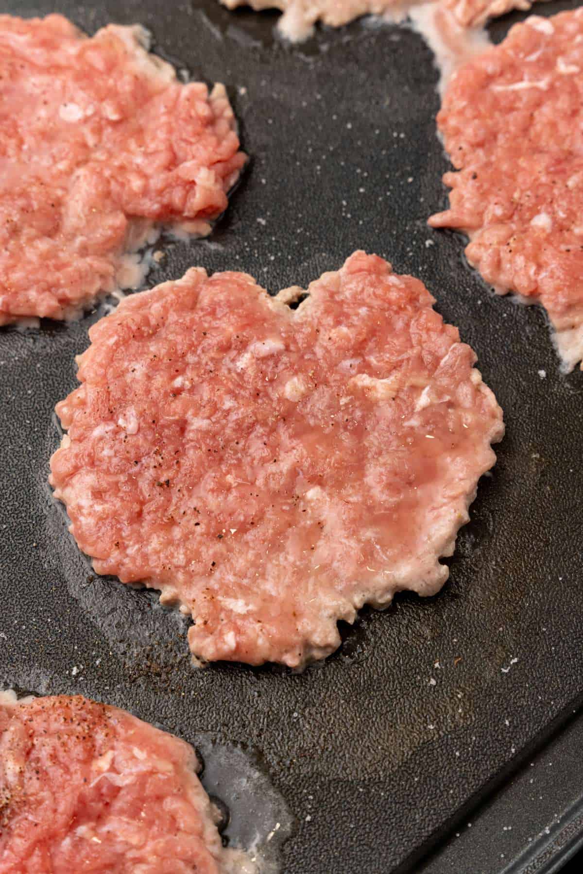  Smash Burgers sizzling on a griddle
