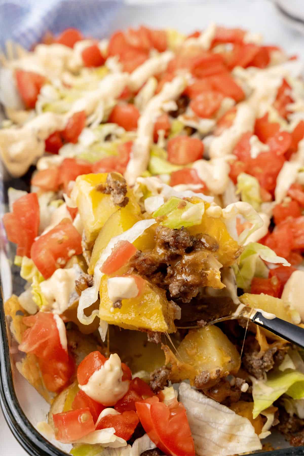 A tasty twist on a classic, this Big Mac casserole features layers of ground beef, tomatoes, lettuce, melted cheese, and a special sauce.