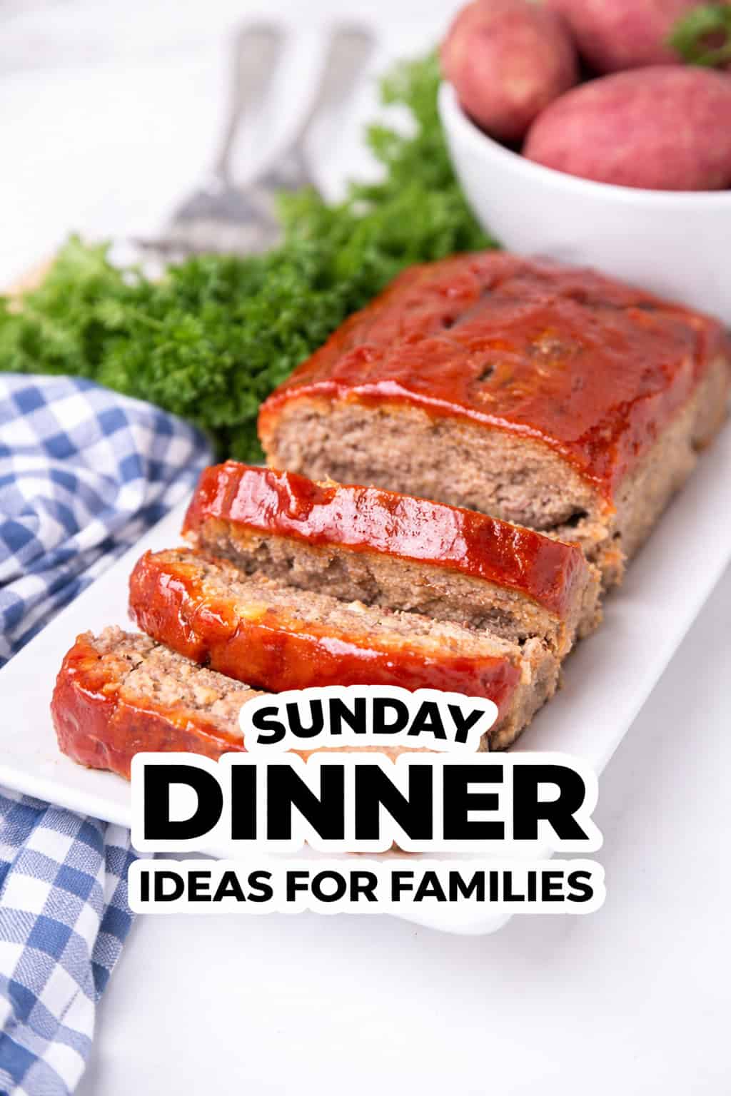 Sliced meatloaf on a white platter with a side of red potatoes and parsley, accompanied by the text "Sunday Dinner Ideas for Families—perfect family dinner recipes to enjoy together.