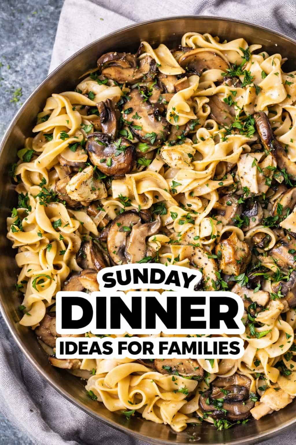 A skillet filled with pasta, mushrooms, chicken, and herbs, with the text "Family Sunday Dinner Ideas for Families" overlaid in bold letters.