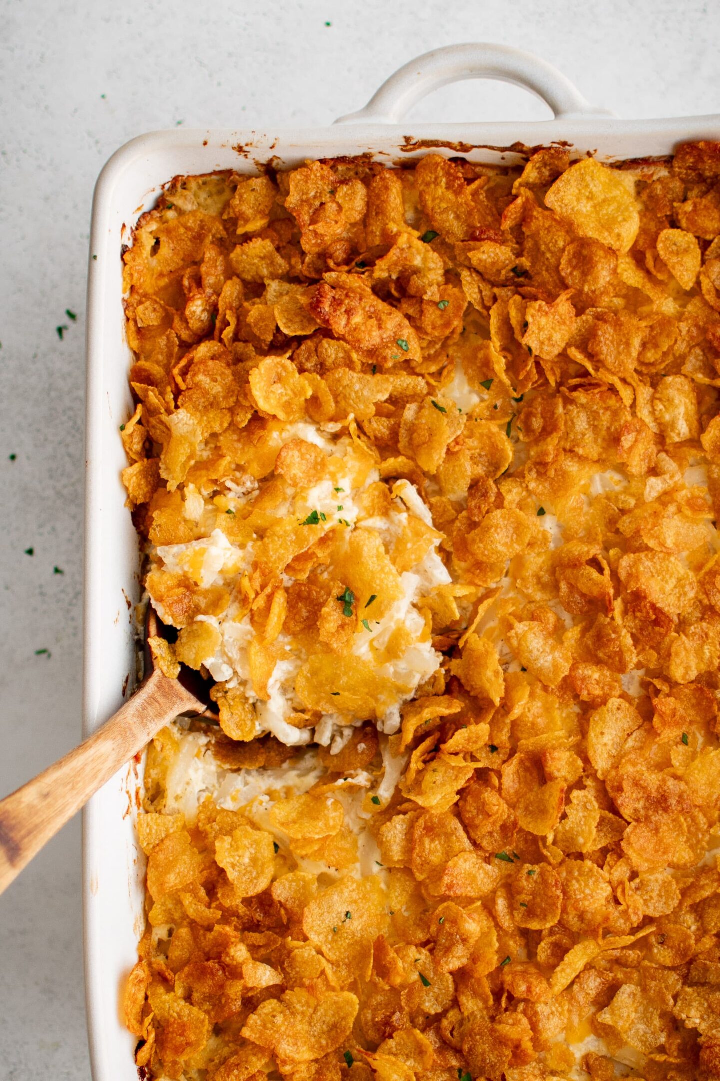 A classic side dish, this casserole features a creamy mixture topped with crisp, golden cornflakes—perfect for serving at any graduation party or as crowd-pleasing party food.