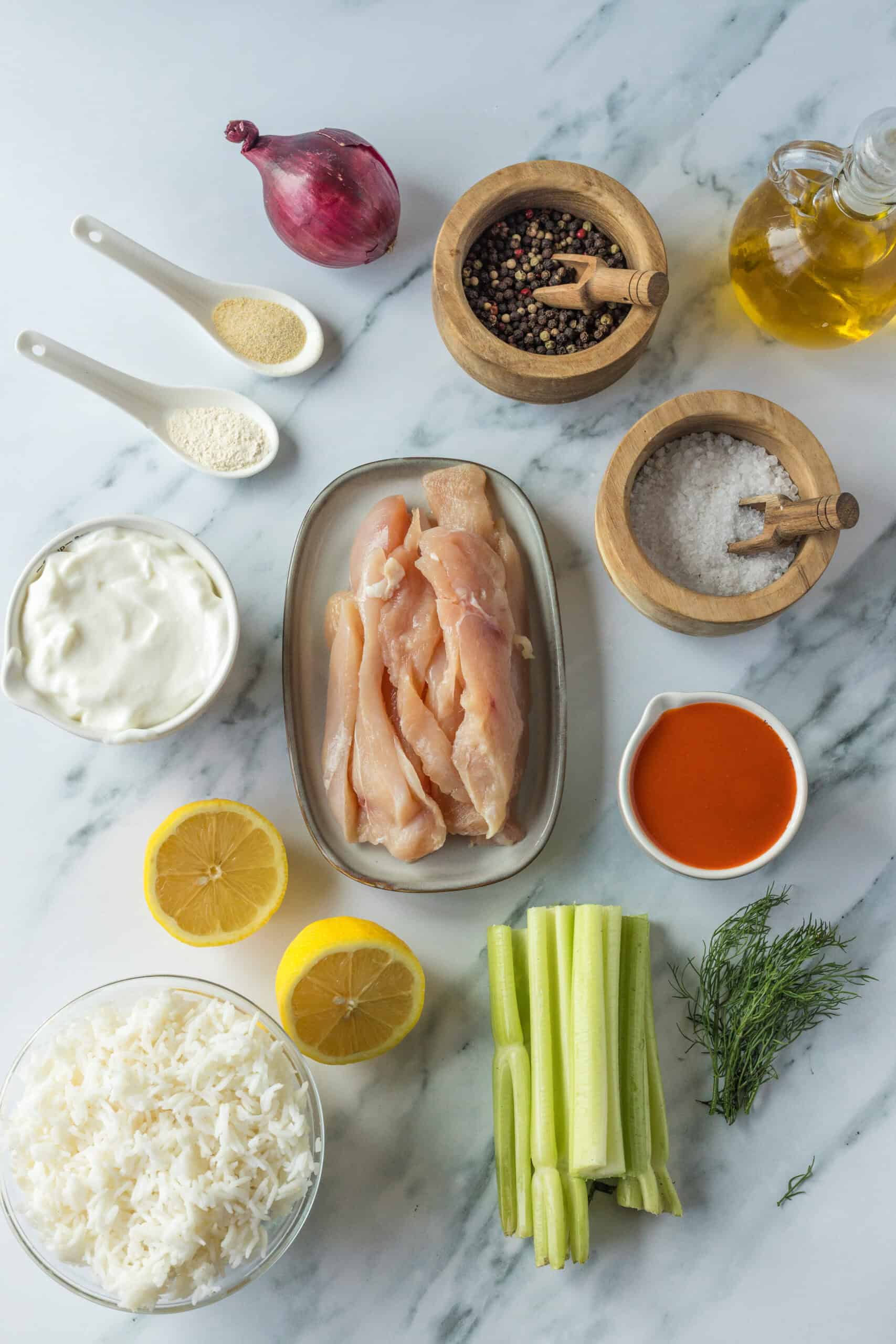 Chicken, rice, celery, red onion, buffalo sauce, sour cream, lemon, dill, and seasonings.