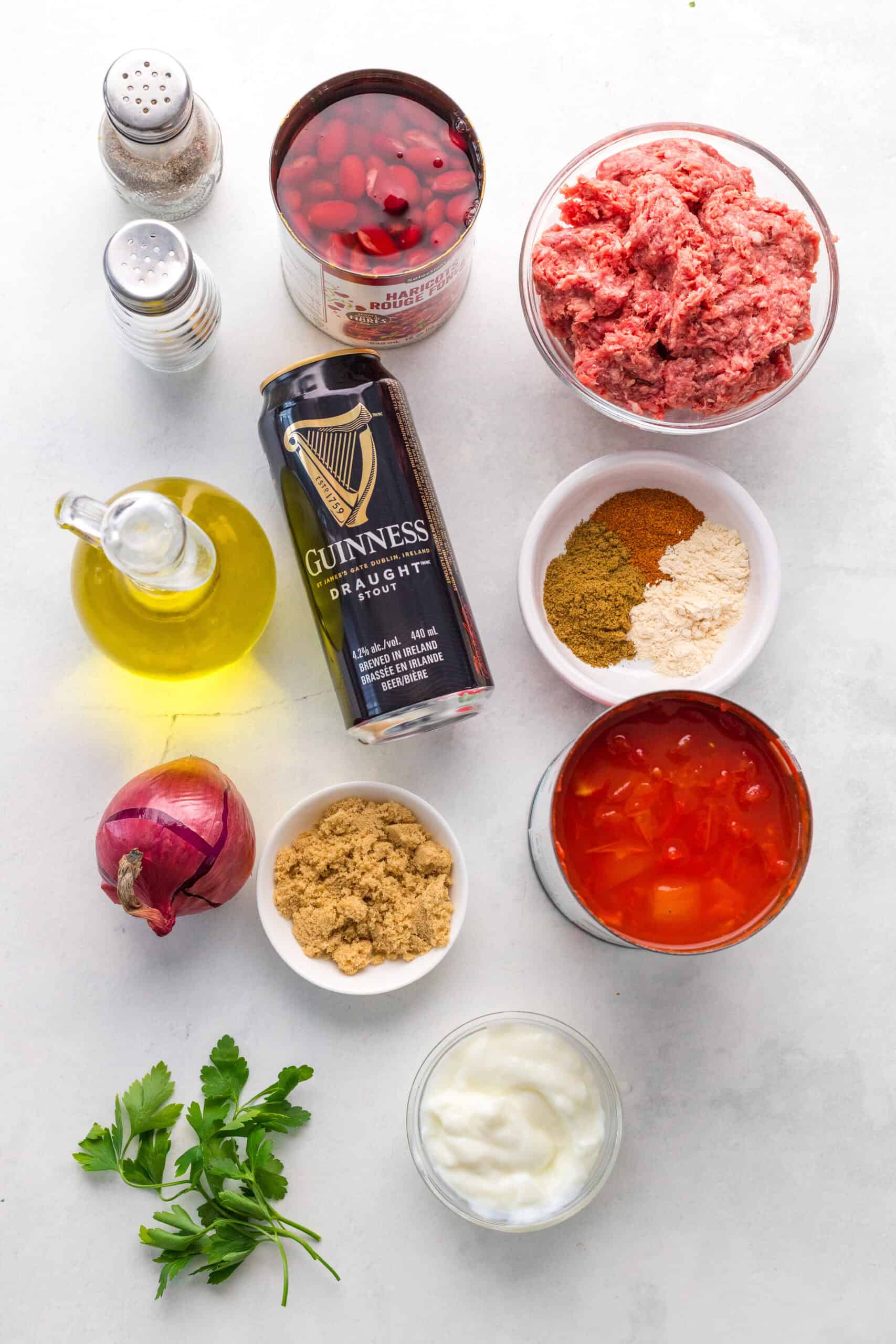 Ground beef, Guinness Draught, diced tomatoes, kidney beans, onion, brown sugar, spices, parsley, and sour cream.