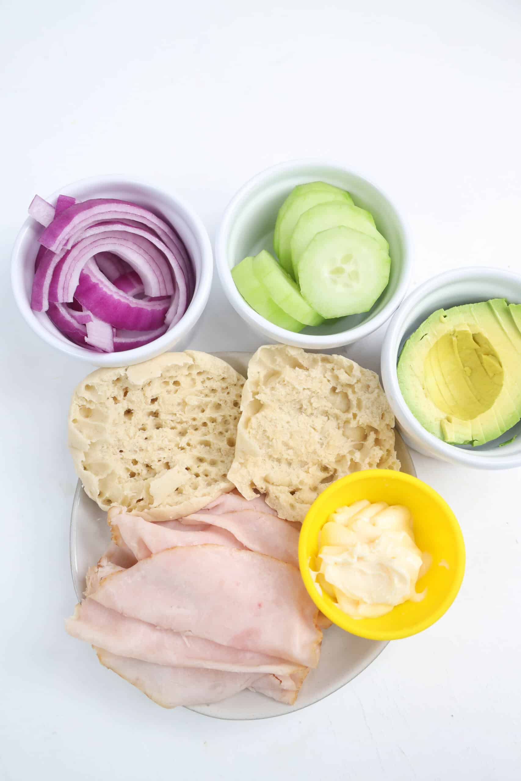 Turkey, English muffin, avocado, cucumber, red onion, and mayonnaise.