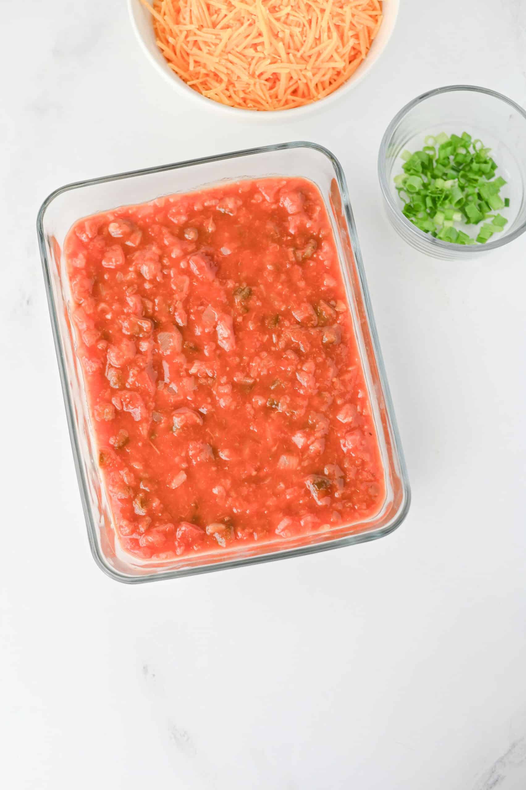 Salsa spread over the creamy nacho dip base.