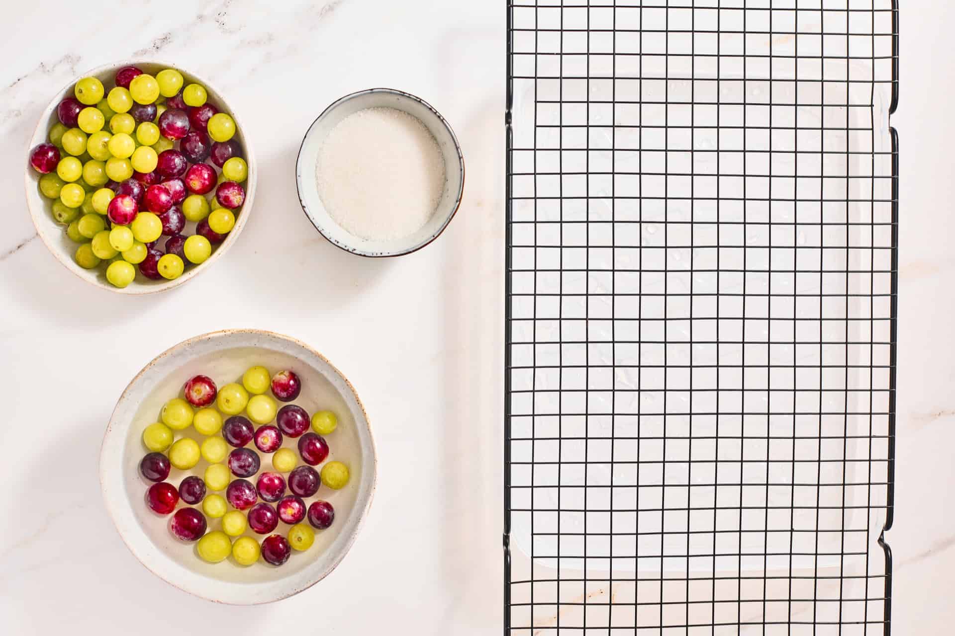 Red and green grapes dipped in warm simple syrup.