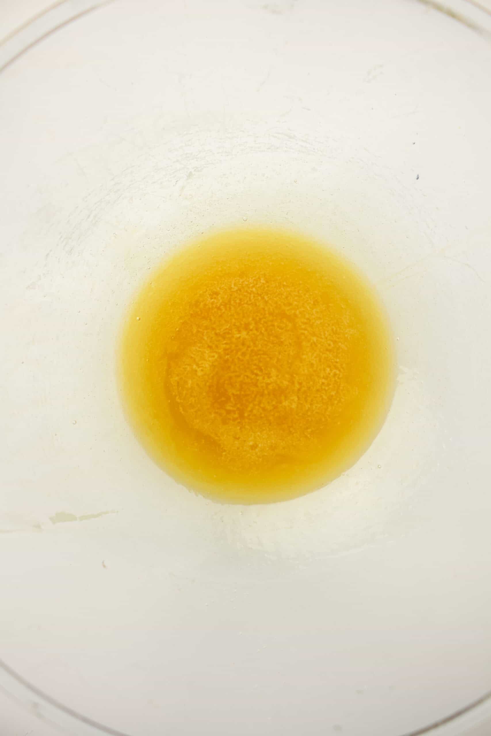 Melted honey and butter mixture in a glass bowl.