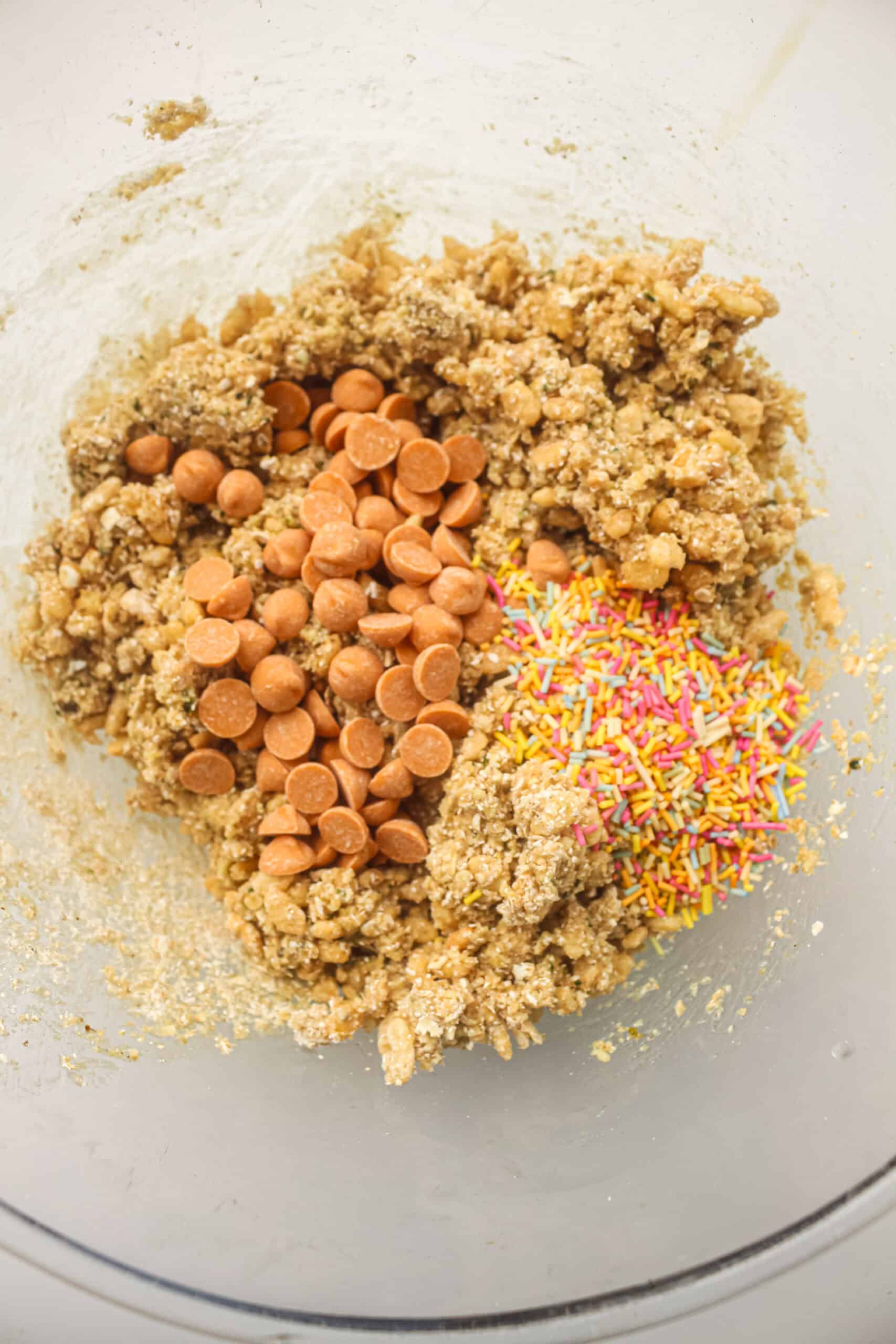 Butterscotch chips and colorful sprinkles added to the energy ball mixture.