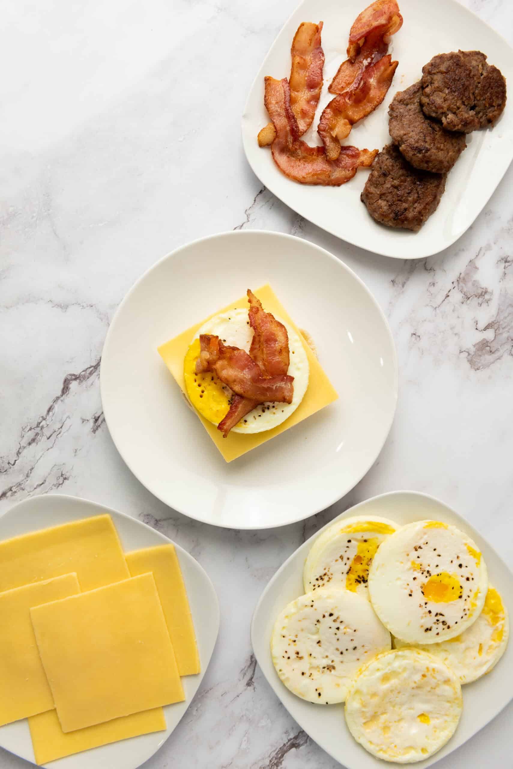 Cooked bacon added to an egg and cheese breakfast sandwich.