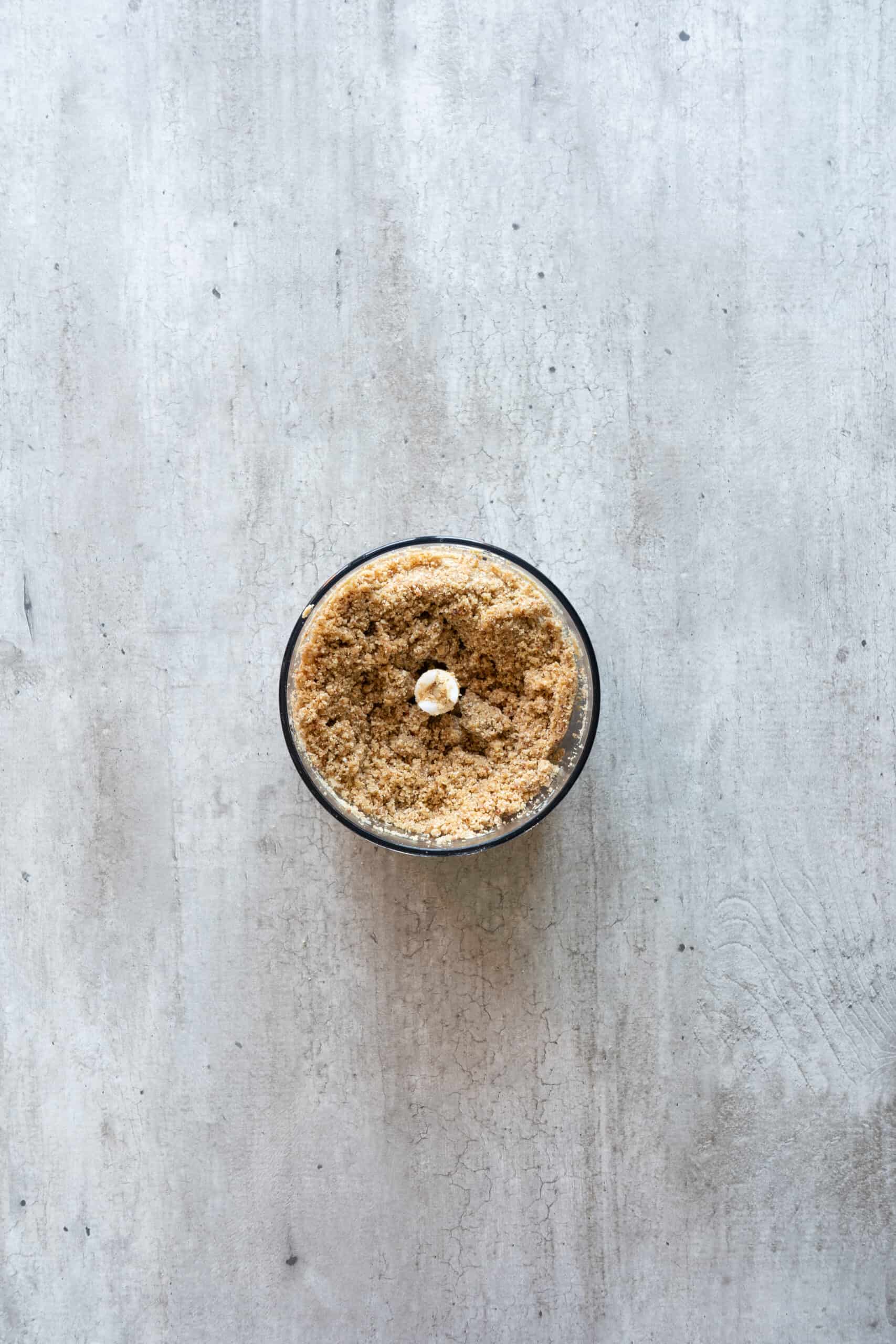 Oats and cashews blended to a fine crumbly texture in a food processor.