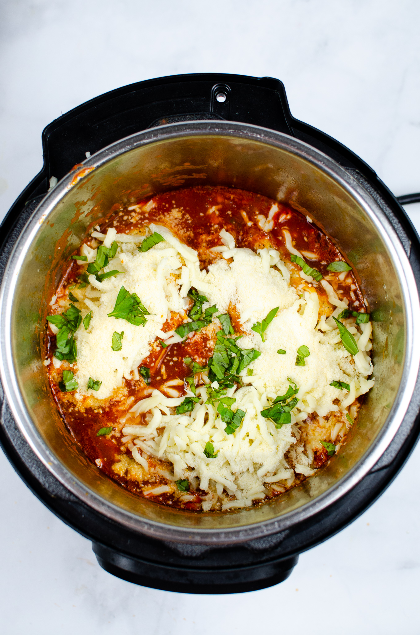 Pressure-cooked chicken topped with mozzarella, Parmesan, and fresh basil.