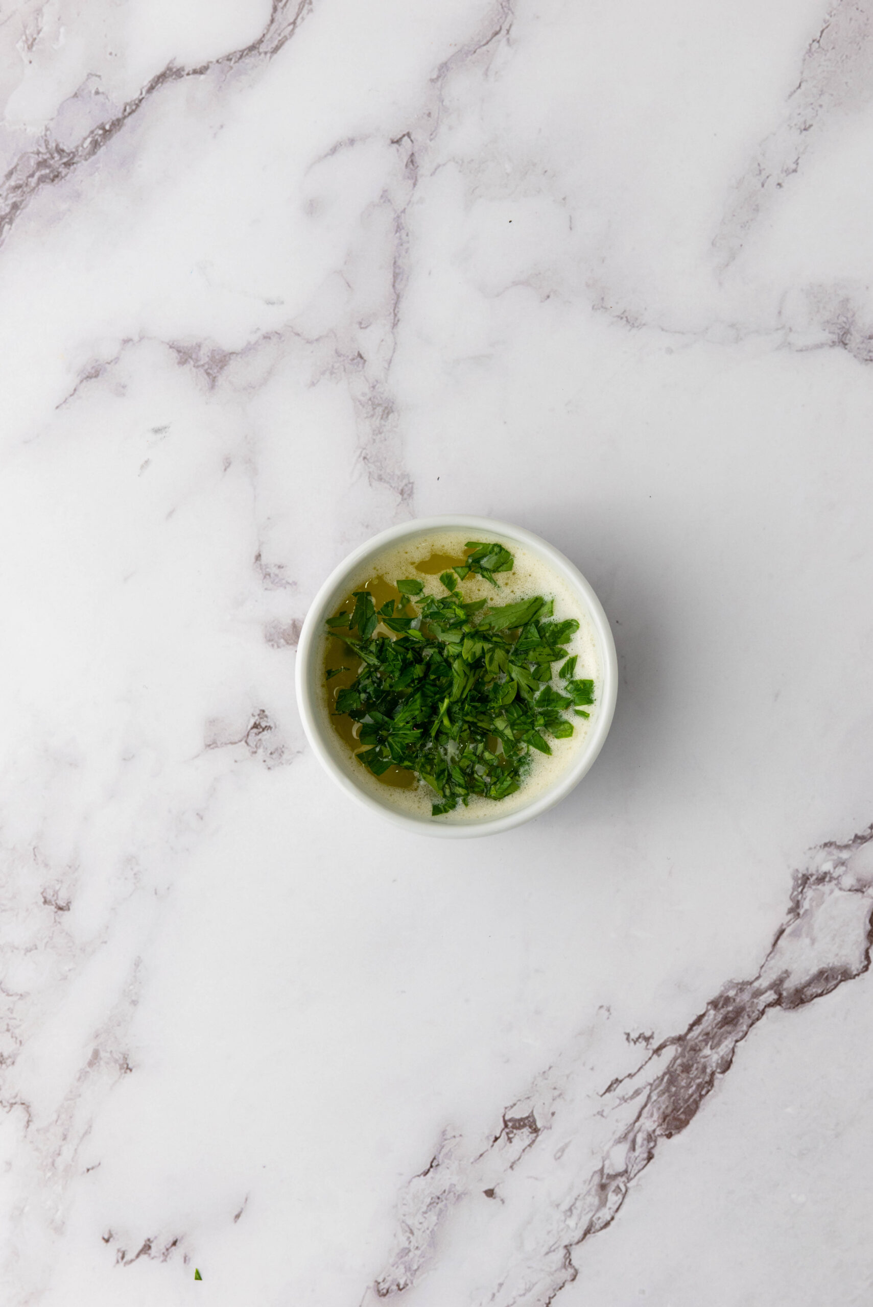 Melted butter mixed with minced garlic and chopped parsley.
