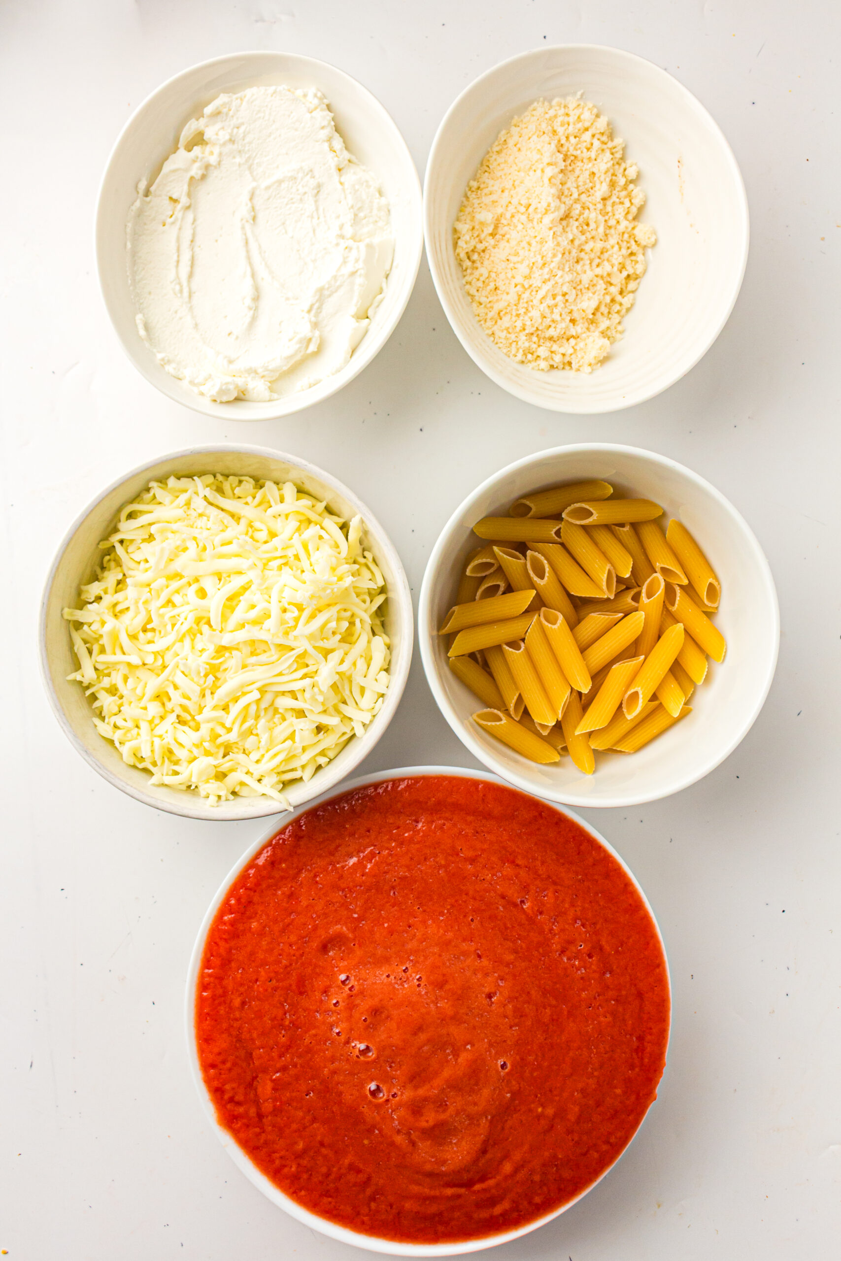 Ziti pasta, marinara sauce, ricotta, mozzarella, and parmesan for baked ziti.