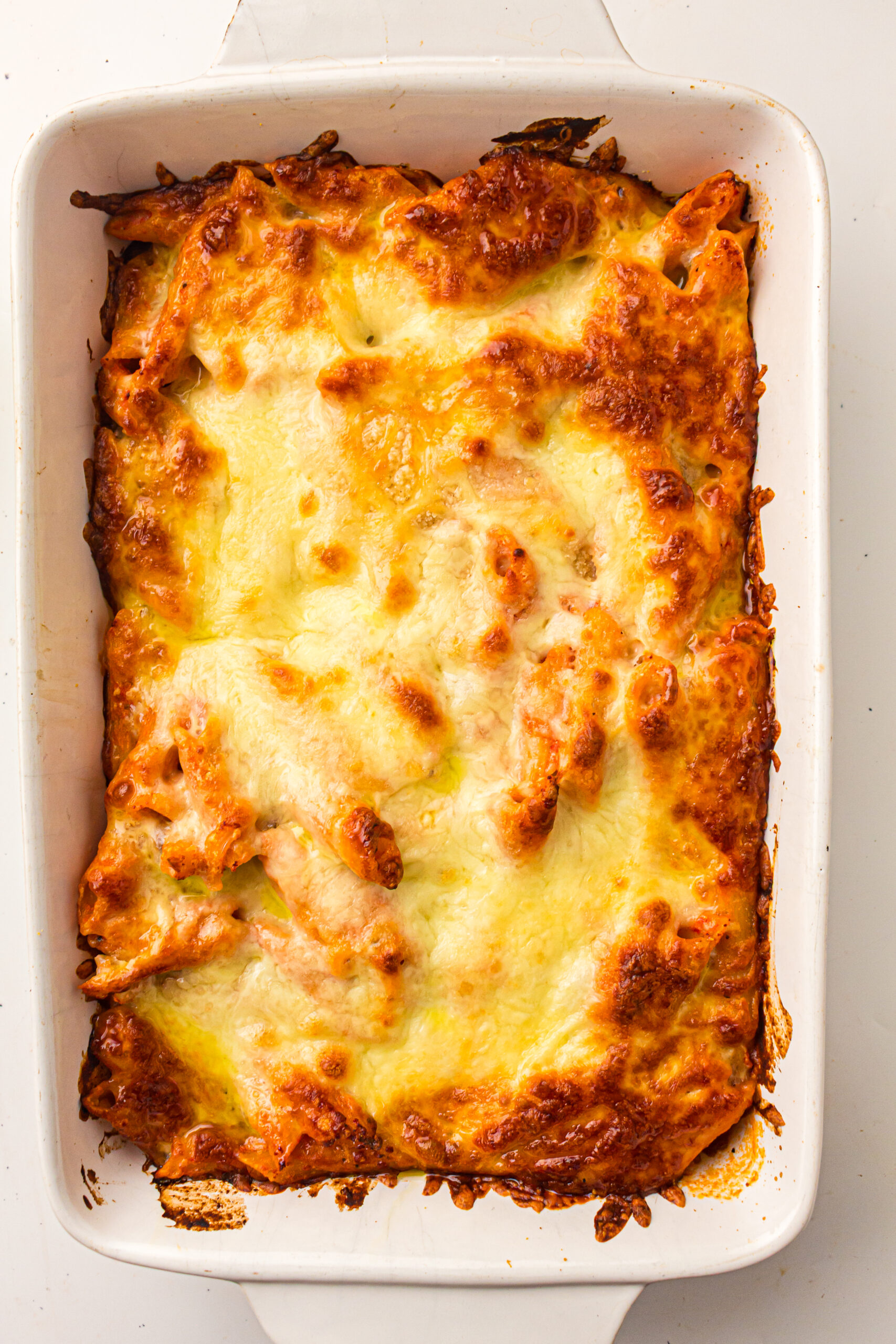 Baked ziti with melted, bubbly, golden-brown cheese.