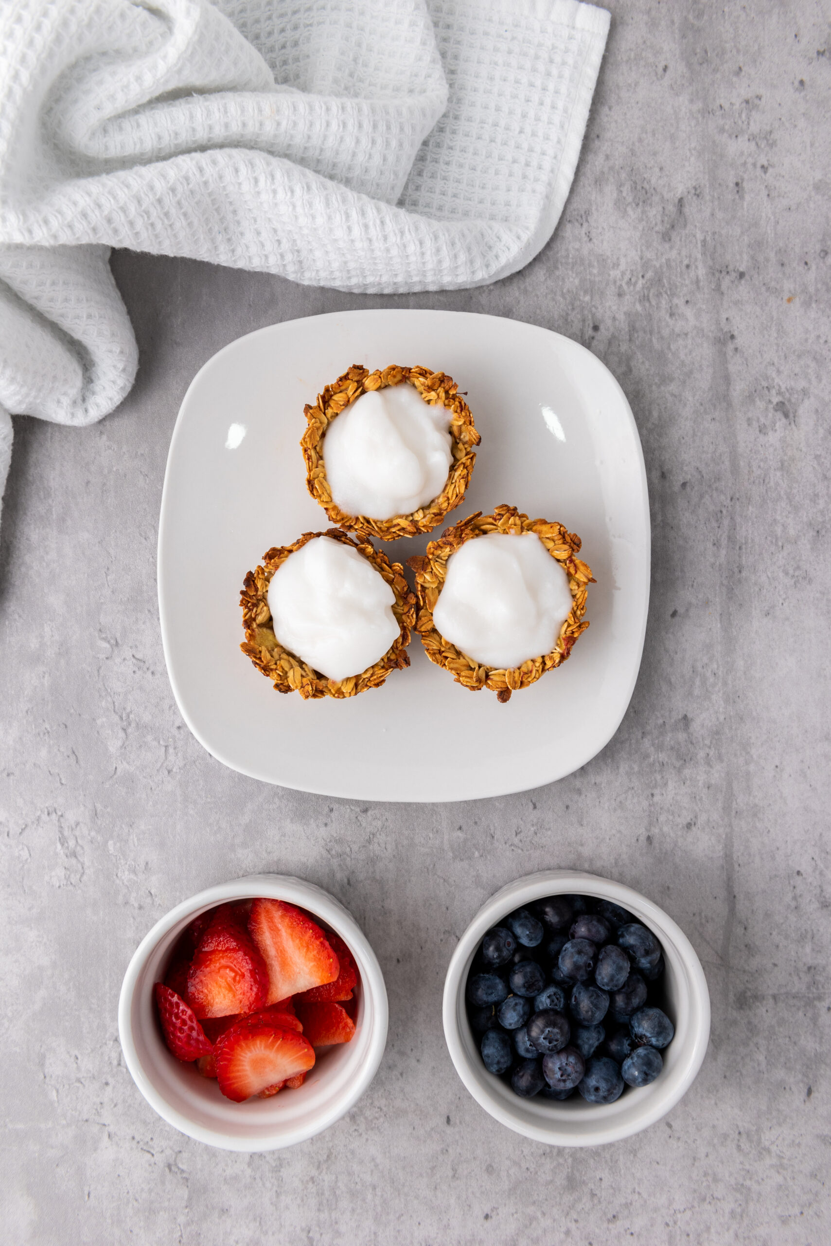 Baked granola cups filled with creamy yogurt.