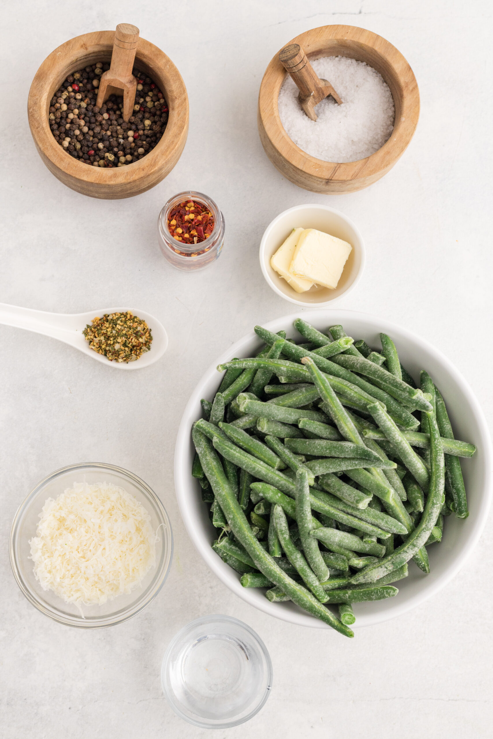 Frozen green beans, butter, Parmesan, Italian seasoning, water, salt, pepper, and chili flakes.