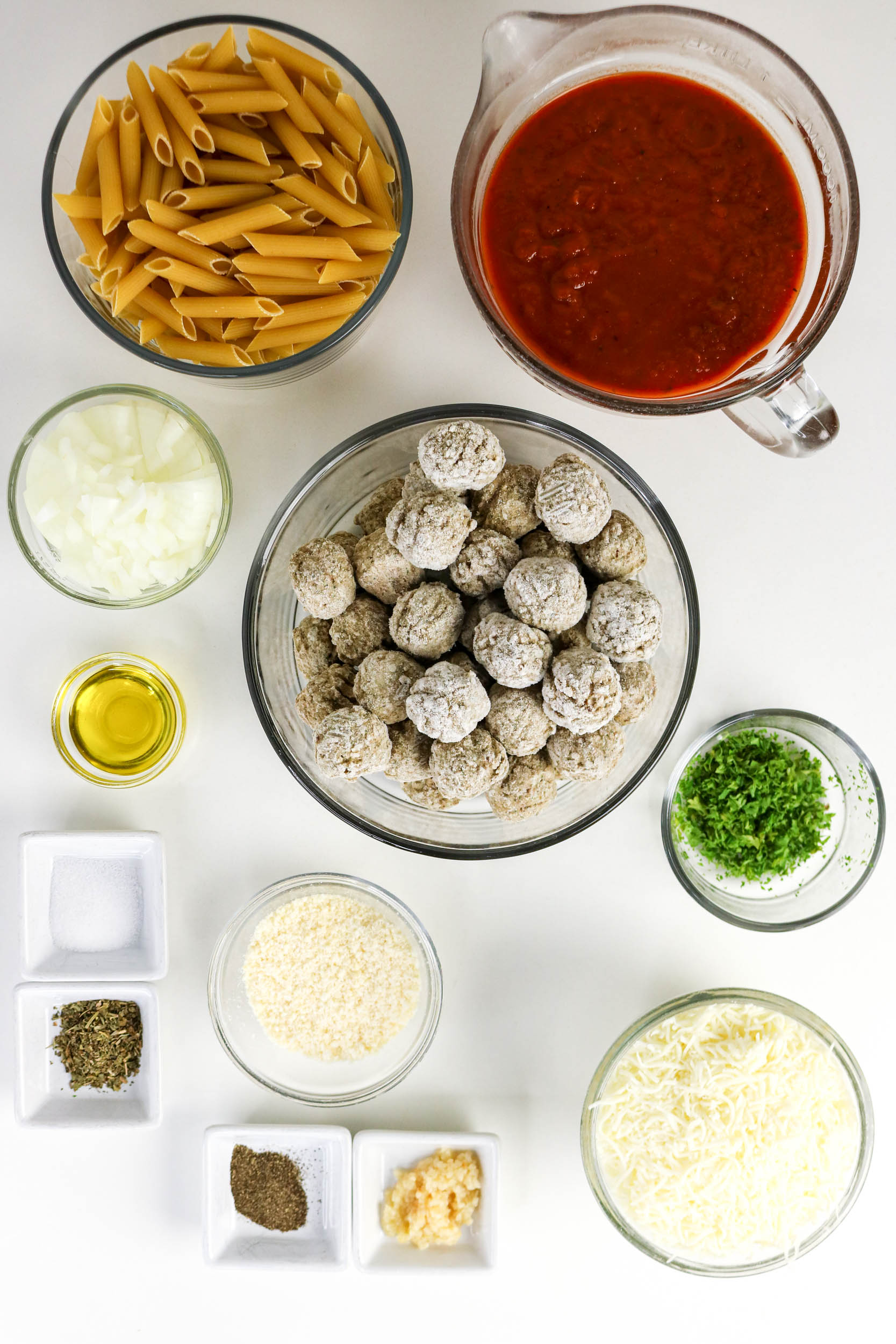 Penne, marinara, frozen meatballs, cheeses, onion, garlic, and seasonings