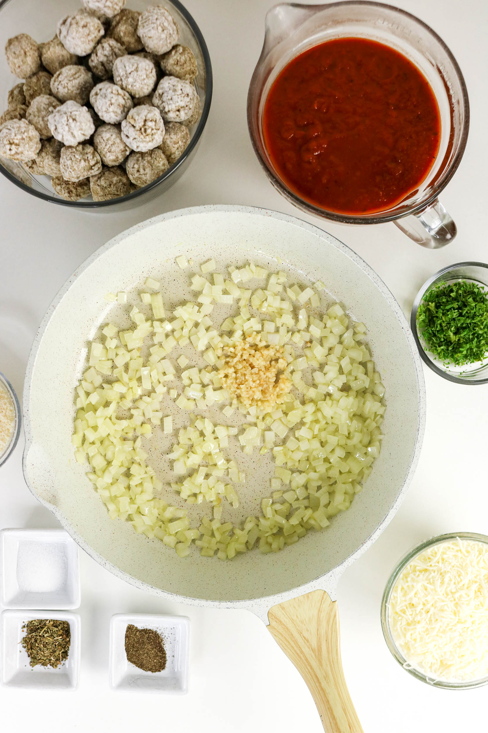 Minced garlic added to softened diced onion