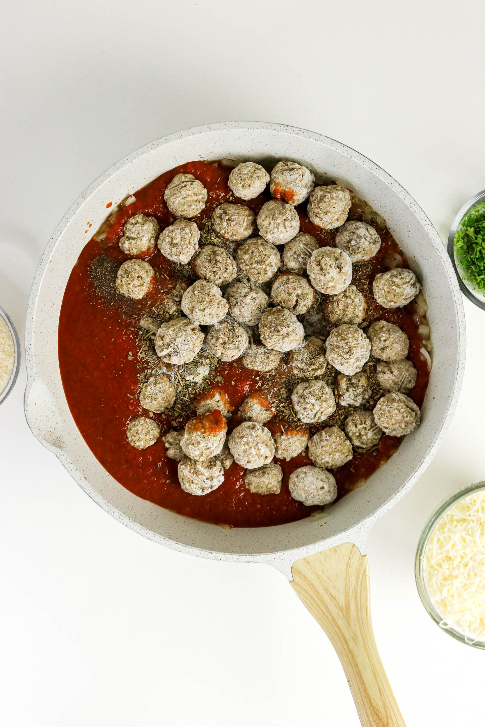 Frozen meatballs and Italian seasoning added to marinara sauce