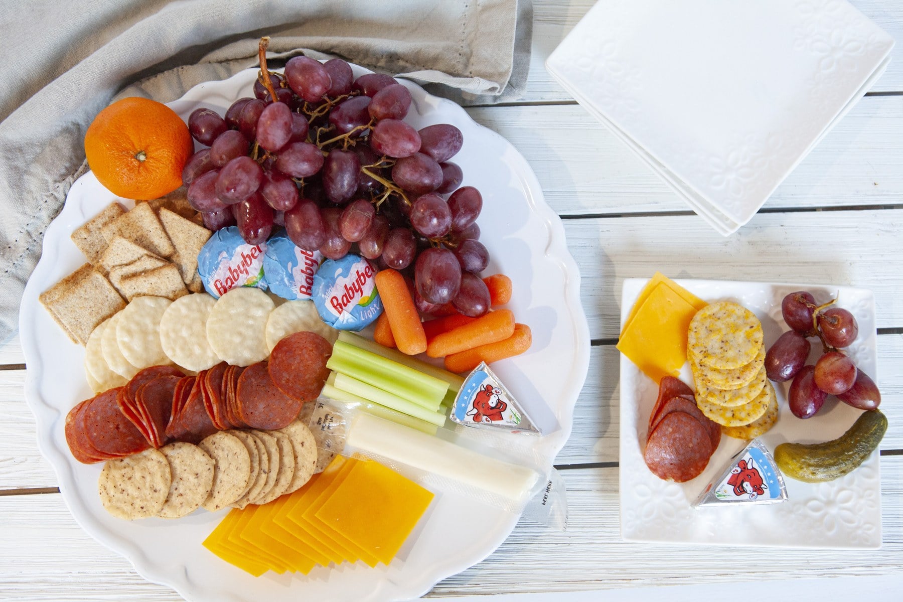 Healthy charcuterie board with a small single-serving snack plate.